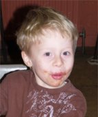 Child with chocolate on face