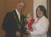 Jane Acott receives the Mayor's Trophy for the Harvest Home's display