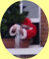 Blurred close up of Father Christmas tipping snow on the mayor